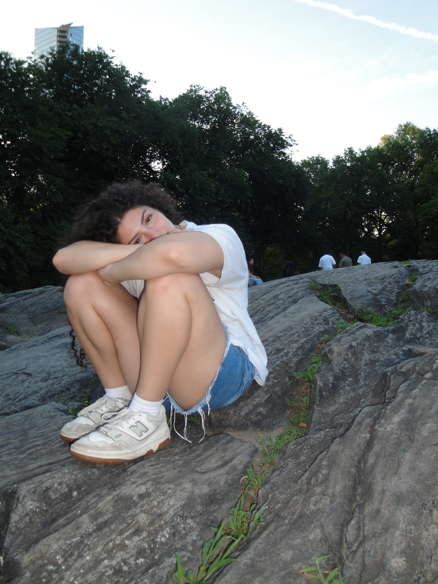 Carinne sitting on a rock in Central Park